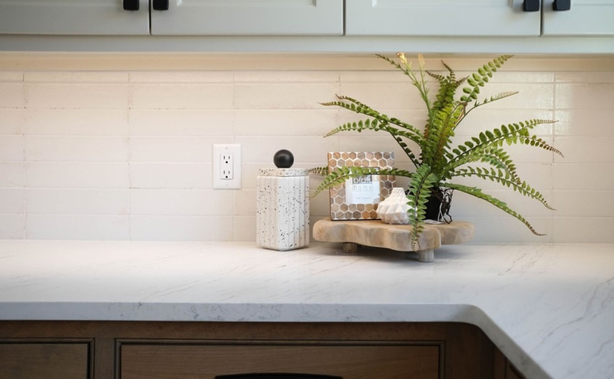 kitchen with white and blue cabinets and white countertops